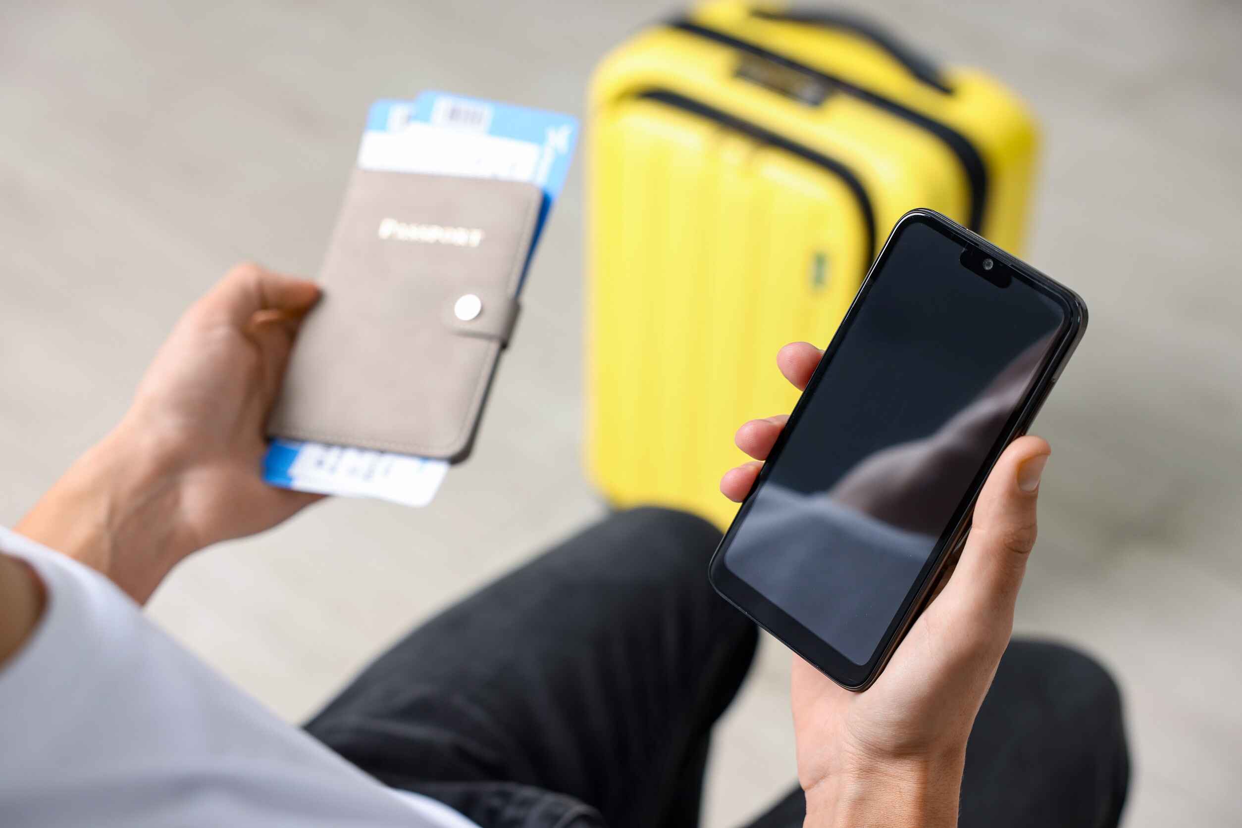 Traveller With Passport Flight Tickets And Smartphone